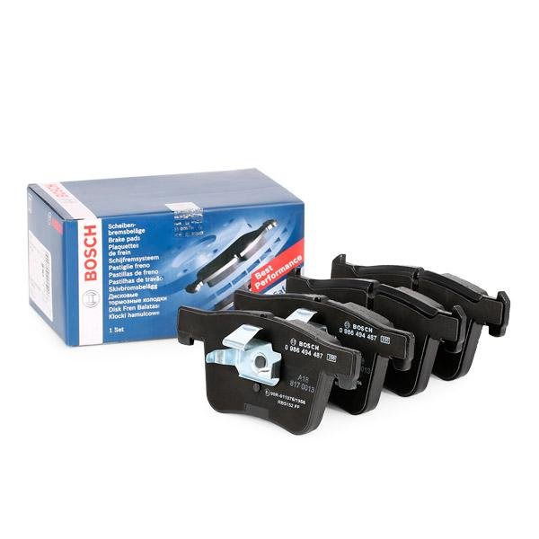BOSCH 0 986 494 487 Disc brake pad set Low metal content, with piston clamp, with anti-squeak plate